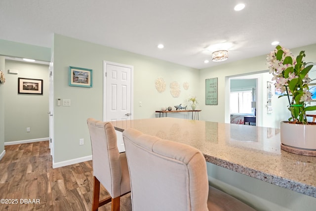 22 Sand Dune Dr, New Smyrna Beach, FL 32169 - dining room with wood finished floors and recessed lighting