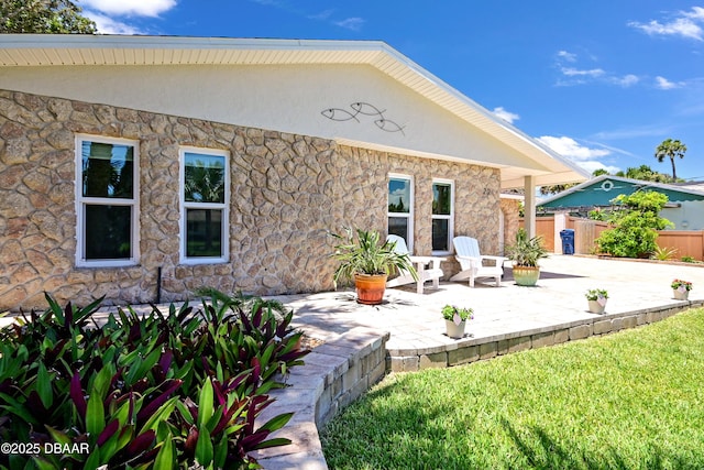 22 Sand Dune Dr, New Smyrna Beach, FL 32169 - back of house with a patio area and stucco siding