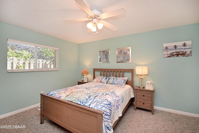 22 Sand Dune Dr, New Smyrna Beach, FL 32169 - carpeted bedroom with baseboards and a ceiling fan