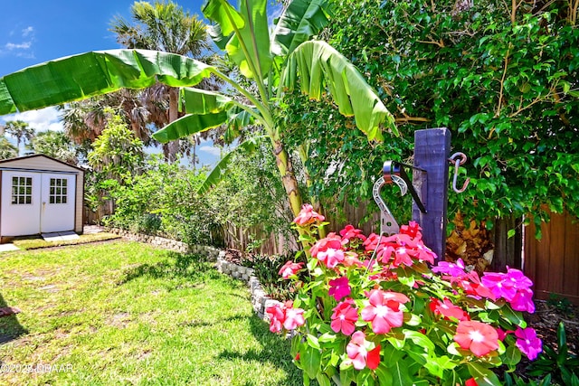 22 Sand Dune Dr, New Smyrna Beach, FL 32169 - fenced backyard with a storage shed