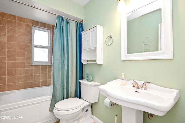 22 Sand Dune Dr, New Smyrna Beach, FL 32169 - bathroom featuring shower / bath combo with shower curtain and toilet