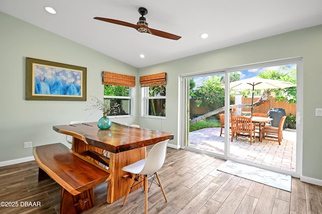 22 Sand Dune Dr, New Smyrna Beach, FL 32169 - dining space with ceiling fan, wood finished floors, plenty of natural light, vaulted ceiling, and recessed lighting