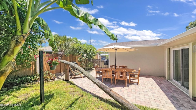 22 Sand Dune Dr, New Smyrna Beach, FL 32169 - view of play area featuring a fenced backyard and a patio area