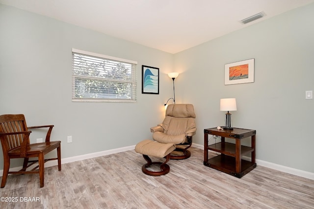 22 Sand Dune Dr, New Smyrna Beach, FL 32169 - living area with light wood-style floors and baseboards