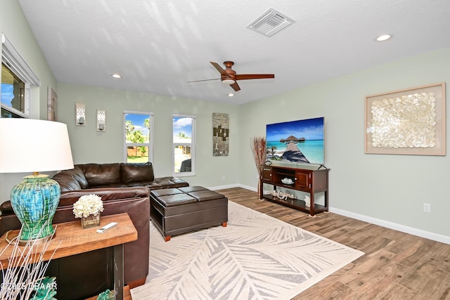 22 Sand Dune Dr, New Smyrna Beach, FL 32169 - living room with wood finished floors, ceiling fan, and recessed lighting