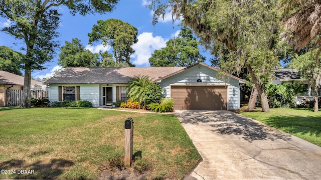 ranch-style home with a front lawn and a garage