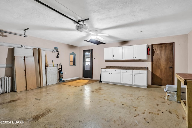 75 Sycamore Cir, Ormond Beach, FL 32174 - garage featuring a garage door opener and ceiling fan