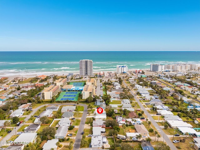 bird's eye view with a water view and a view of the beach