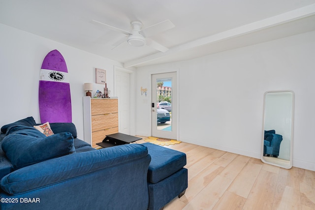 living room with ceiling fan and hardwood / wood-style floors