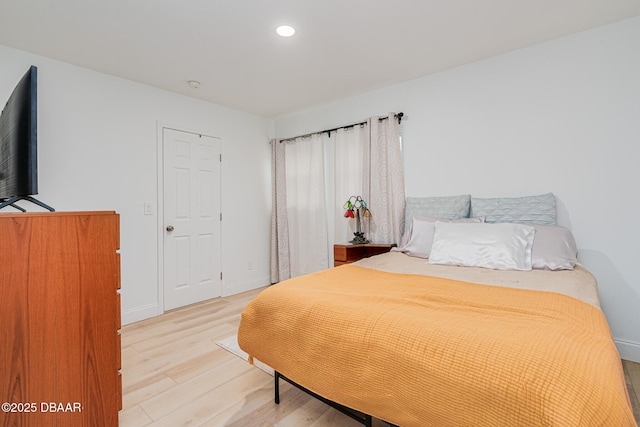 bedroom with hardwood / wood-style floors