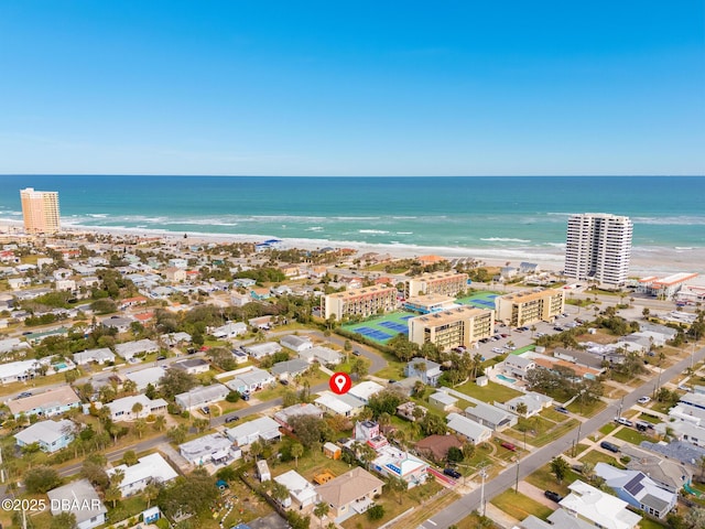 aerial view featuring a water view and a view of the beach