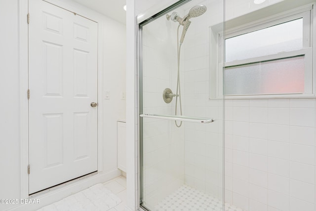 bathroom featuring walk in shower and tile patterned floors