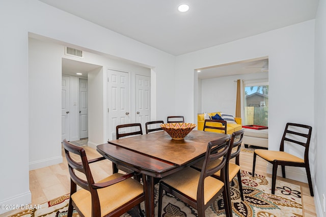 dining space featuring light tile patterned floors