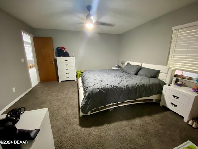 bedroom with dark carpet and ceiling fan