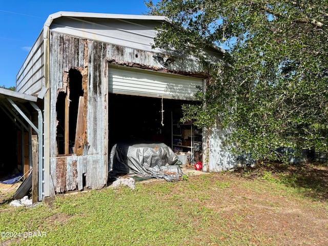 exterior space with a lawn and a garage