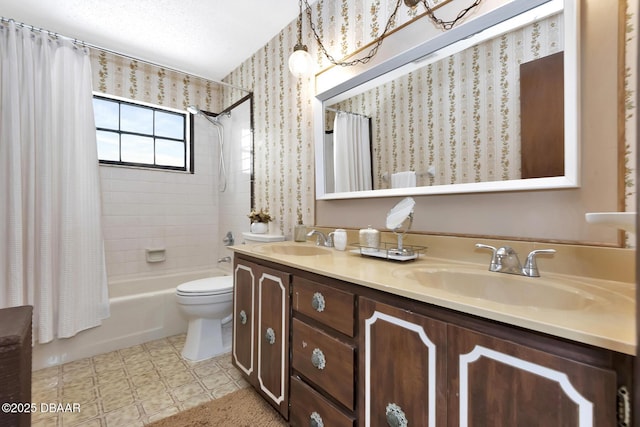 full bathroom featuring vanity, shower / tub combo with curtain, and toilet