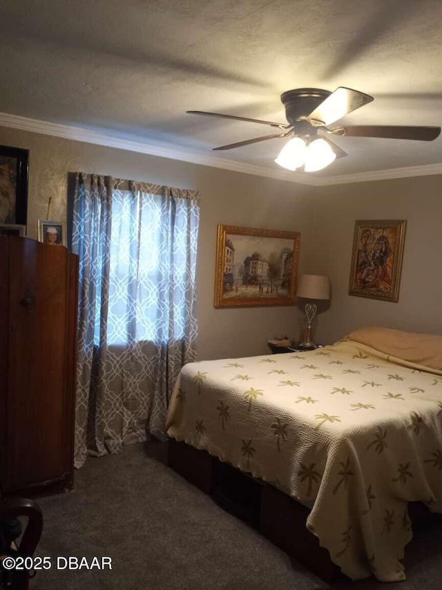 bedroom with carpet flooring, crown molding, and ceiling fan