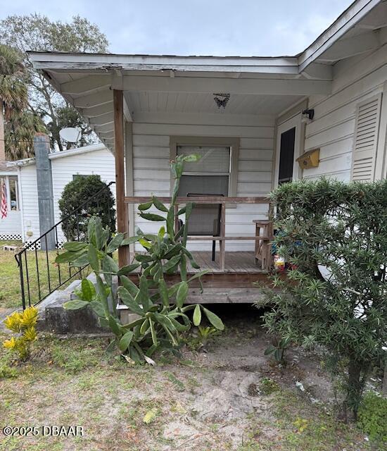 entrance to property with a porch