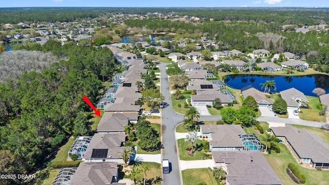 bird's eye view featuring a residential view and a water view