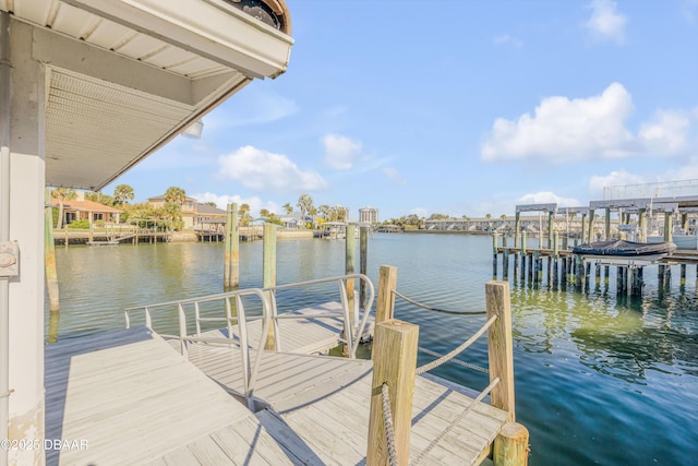 view of dock featuring a water view and boat lift