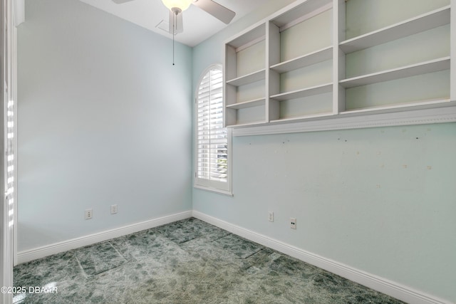 unfurnished room featuring ceiling fan, carpet flooring, and baseboards