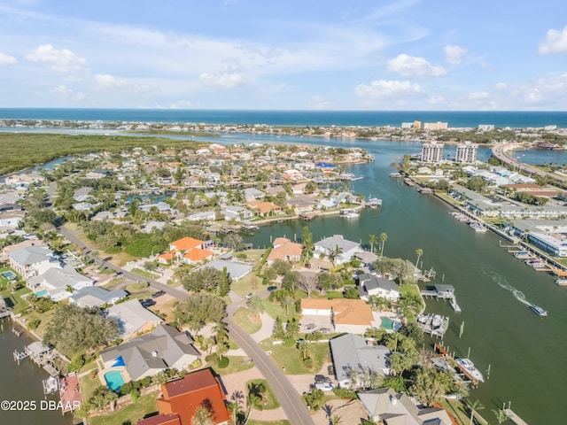 aerial view featuring a residential view and a water view