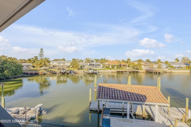 dock area featuring a water view and a residential view