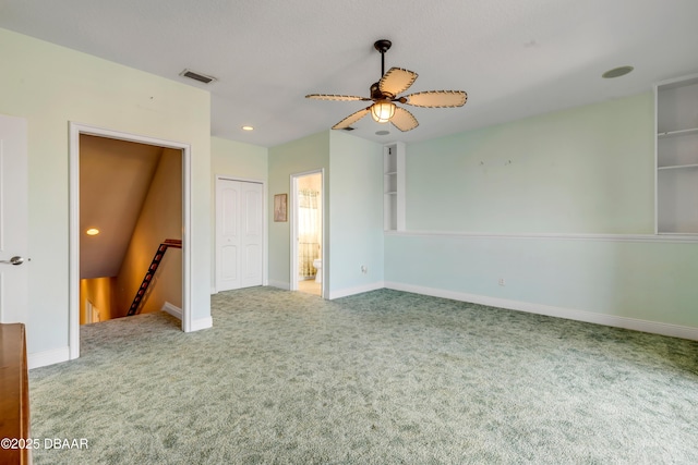 unfurnished bedroom featuring a closet, carpet, visible vents, and baseboards