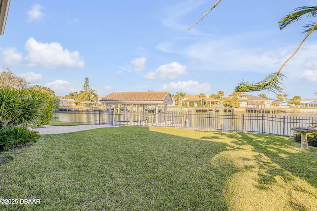 view of yard with a residential view and fence