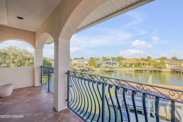 balcony with a water view and a residential view