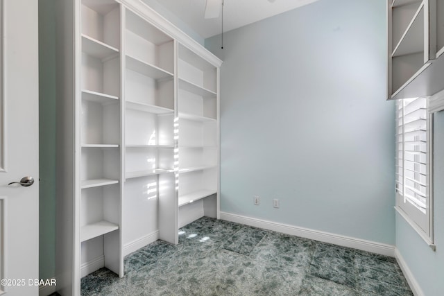 interior space featuring carpet and baseboards