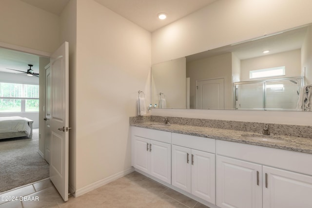 bathroom featuring a stall shower, double vanity, tile patterned flooring, a ceiling fan, and recessed lighting