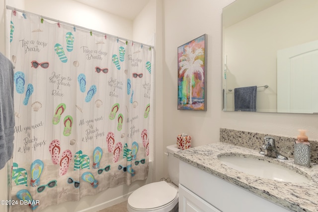 full bathroom with shower / tub combo, vanity, and toilet