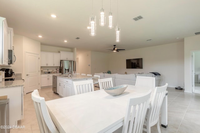 dining area featuring recessed lighting, a ceiling fan, light tile patterned floors, and baseboards