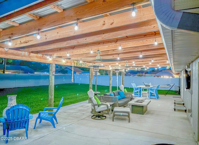 3324 Royal Palm Dr, Edgewater, FL 32141 - fenced backyard featuring a patio area and an outdoor living space with a fire pit