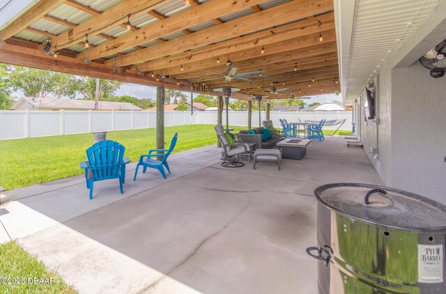 3324 Royal Palm Dr, Edgewater, FL 32141 - fenced backyard with outdoor dining space, a patio area, and ceiling fan