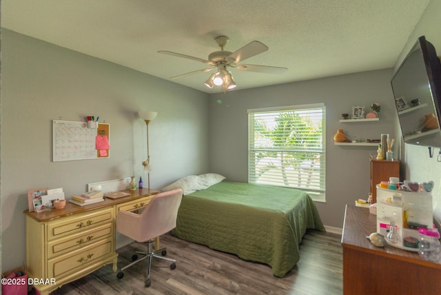 3324 Royal Palm Dr, Edgewater, FL 32141 - bedroom featuring wood finished floors, ceiling fan, and a textured ceiling