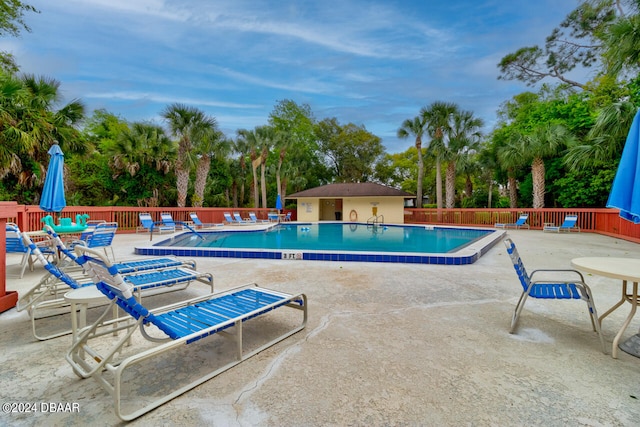 view of swimming pool featuring a patio area