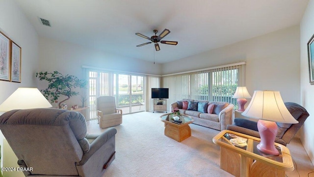 living room featuring light colored carpet and ceiling fan