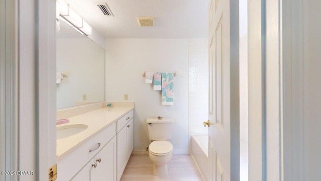 full bathroom with vanity, toilet, and  shower combination