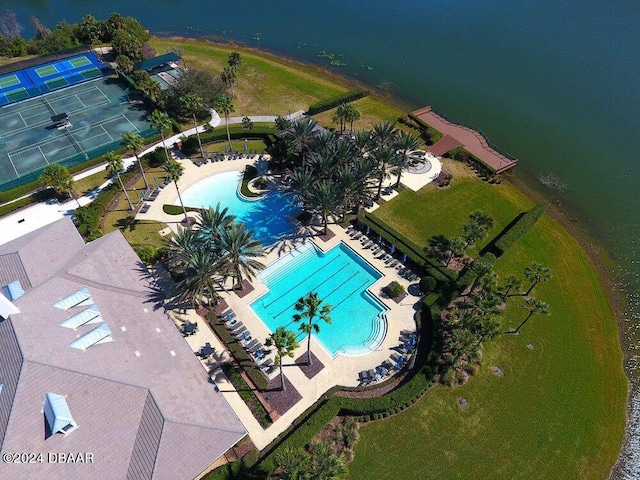 birds eye view of property with a water view