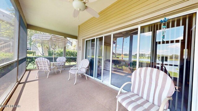 sunroom featuring ceiling fan