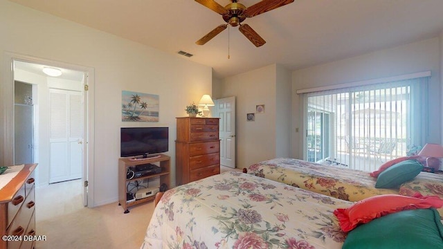 carpeted bedroom featuring ceiling fan and access to exterior