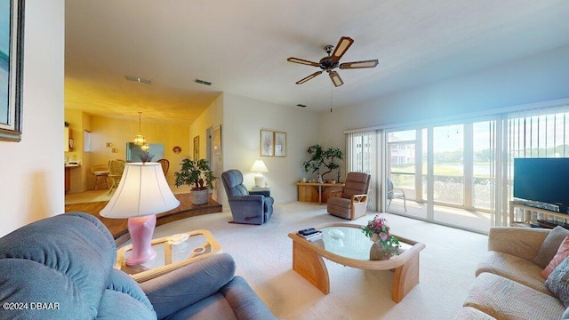 living room featuring ceiling fan and light carpet