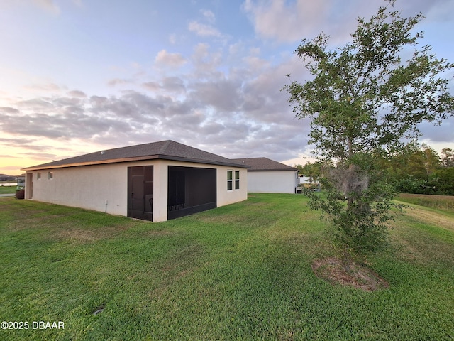 3107 Crab Trap Dr, New Smyrna Beach, FL 32168 - view of green lawn featuring a sunroom