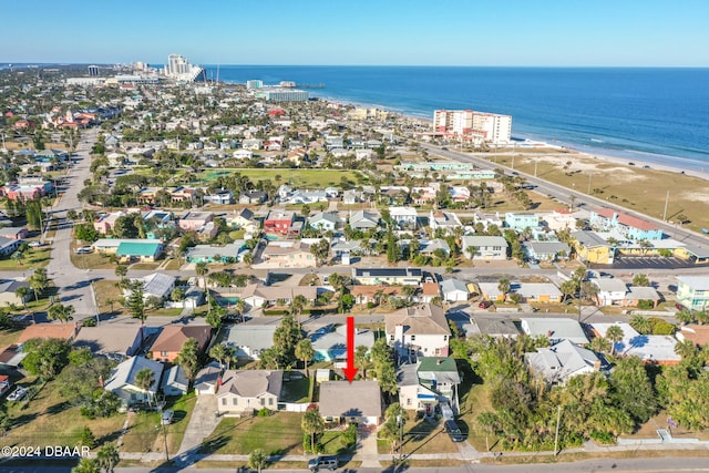 bird's eye view with a water view and a view of the beach