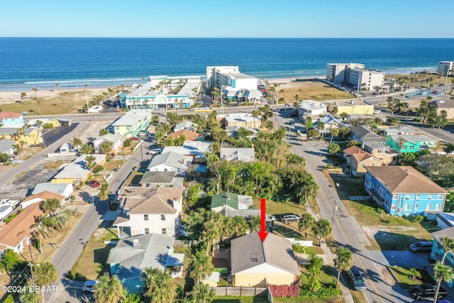 aerial view featuring a view of the beach and a water view