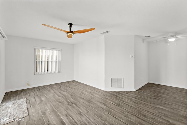 empty room with ceiling fan and hardwood / wood-style floors