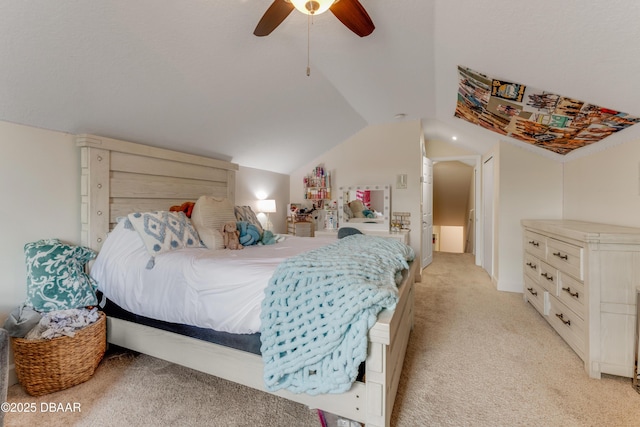 bedroom with light colored carpet, lofted ceiling, and a ceiling fan