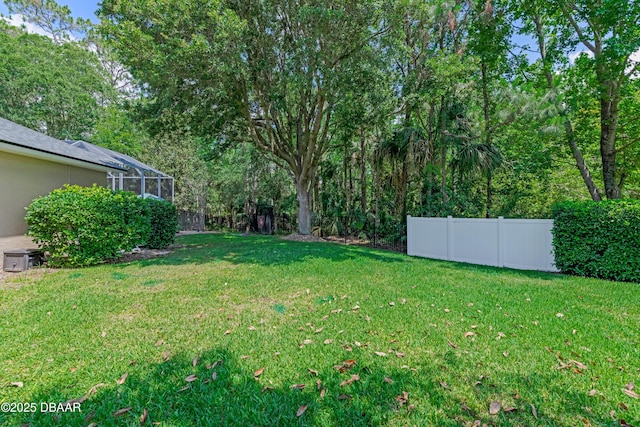 view of yard featuring a lanai
